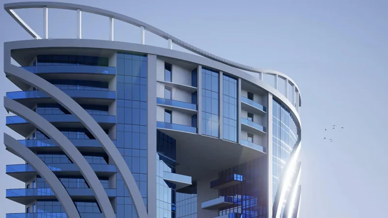 Curving structural frame and glazed elevations of a contemporary building
